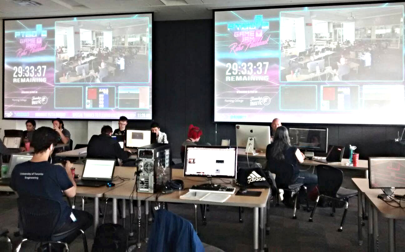 Auditorium with people at tables coding games